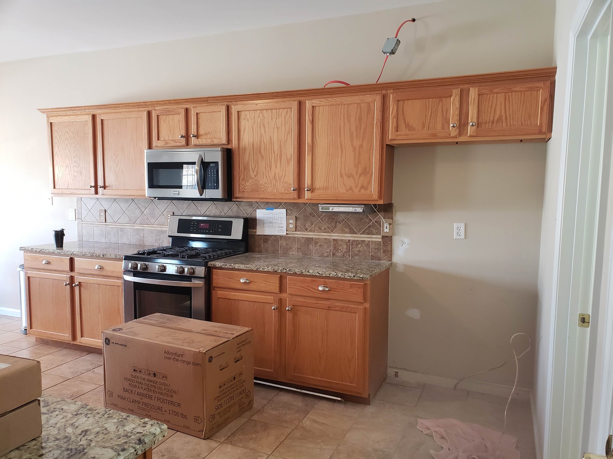 Before Picture: Builder grade oak, 30" wall cabinets
